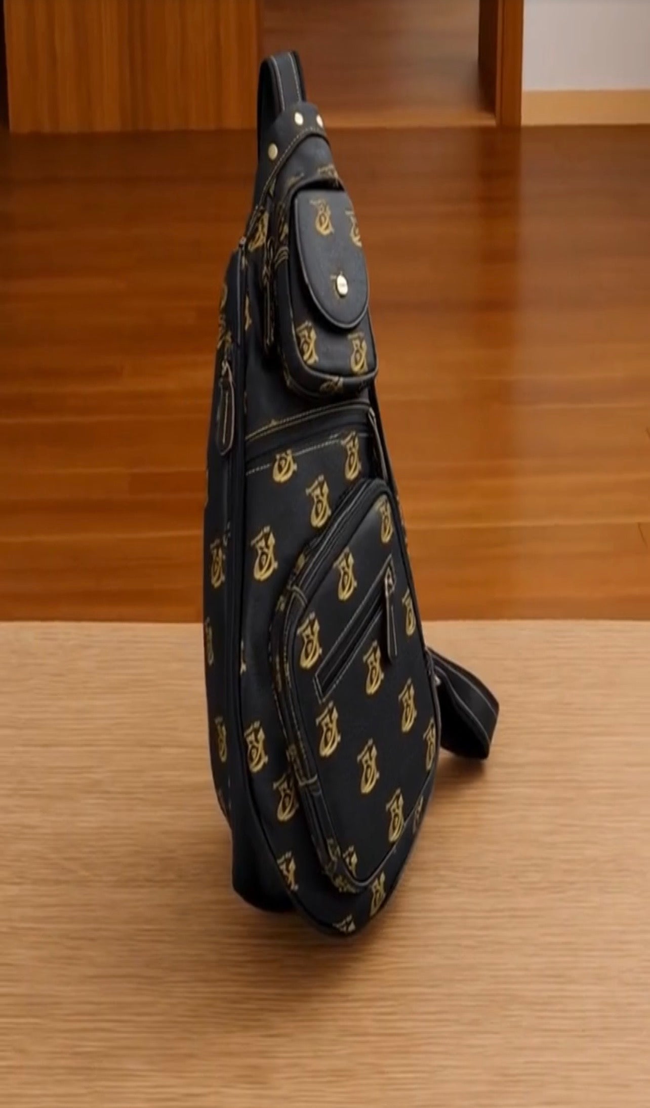 Man wearing Paypd Up Leather Monogram Sling Bag crossbody